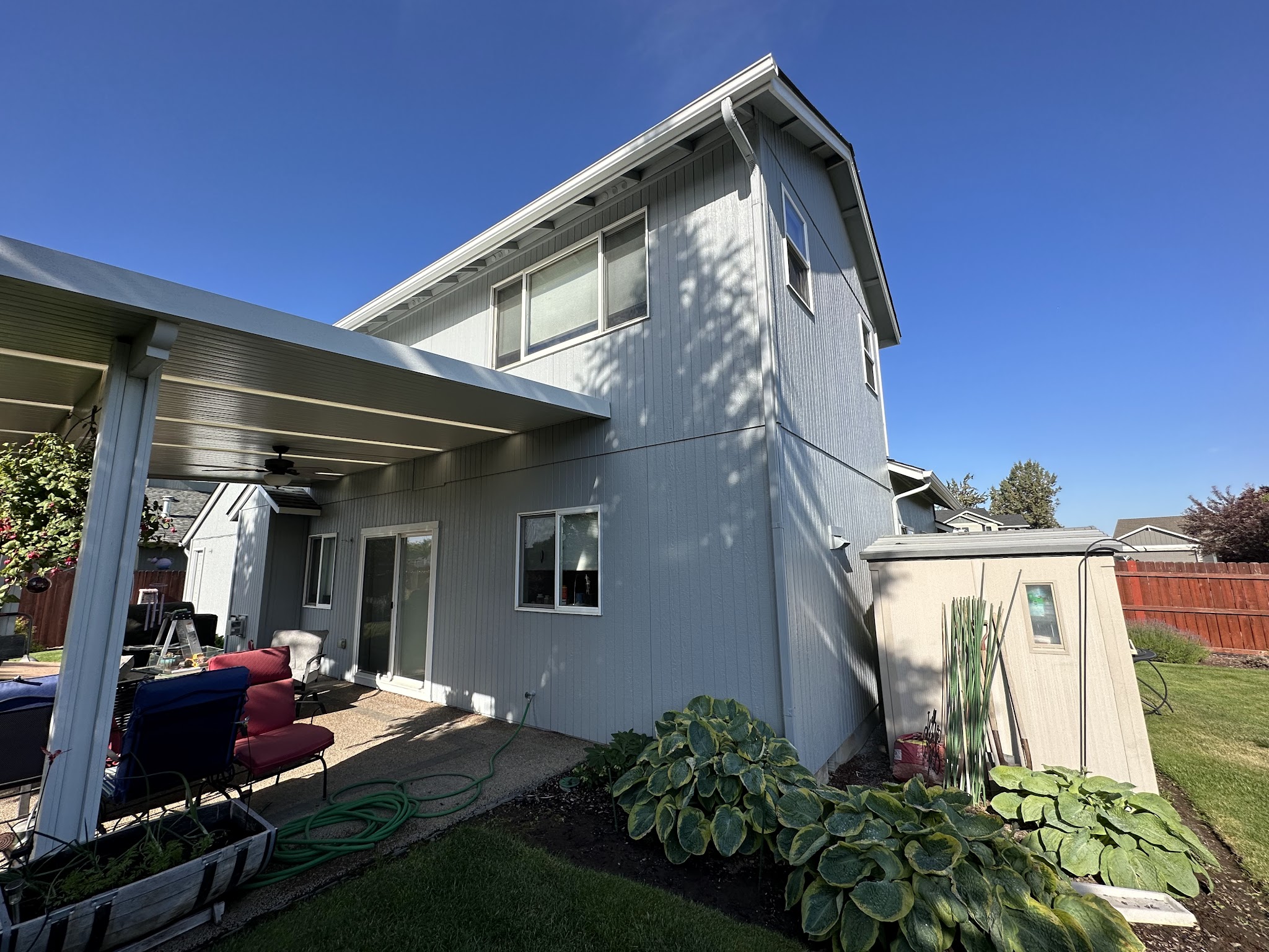 Light grey exterior repaint on a two-story Redmond home