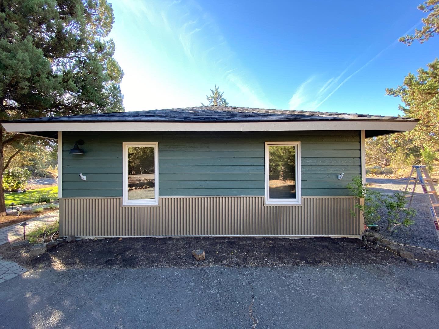 Sage green exterior siding repaint on a Redmond property